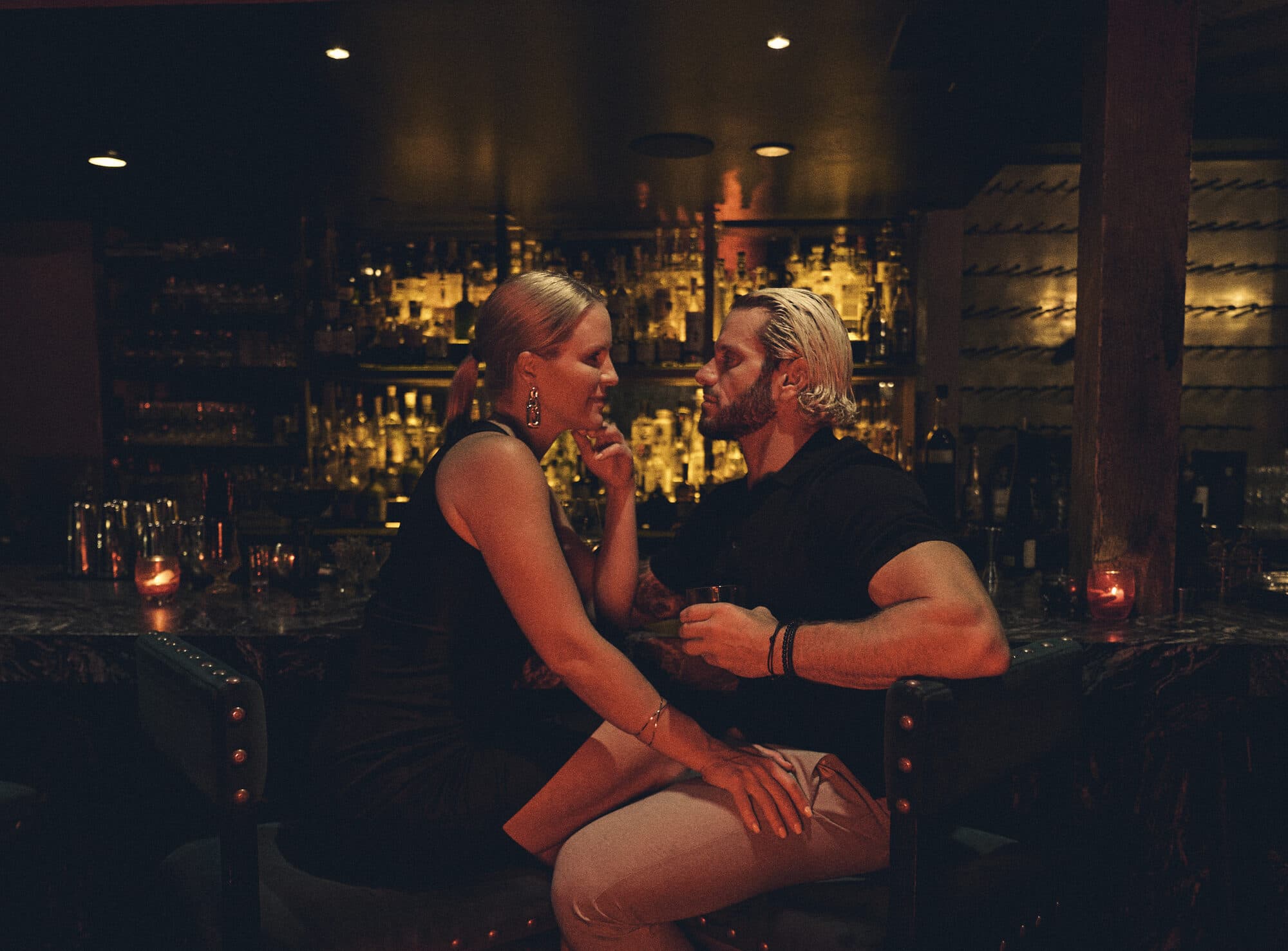 Jarred and Katelyn Curcio close together at the bar